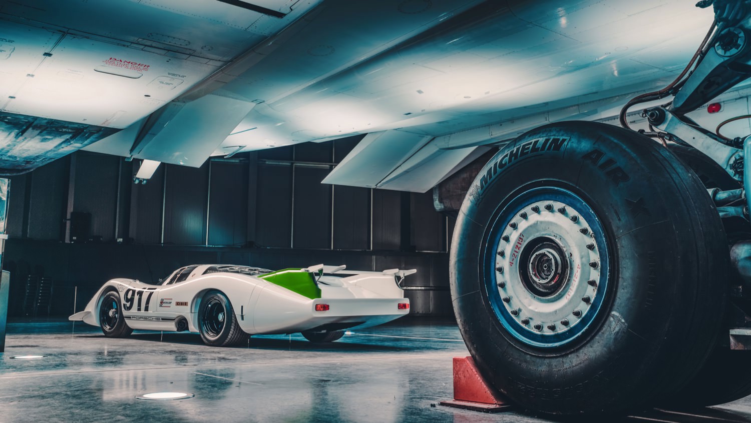 Porsche 917 beside Concorde's wheel
